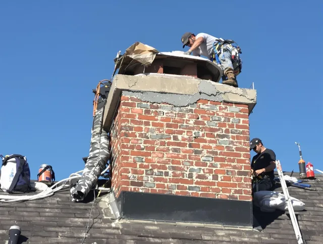 Wallingford Center Chimney Sweep installing a custom chimney crown in Wallingford Center, CT