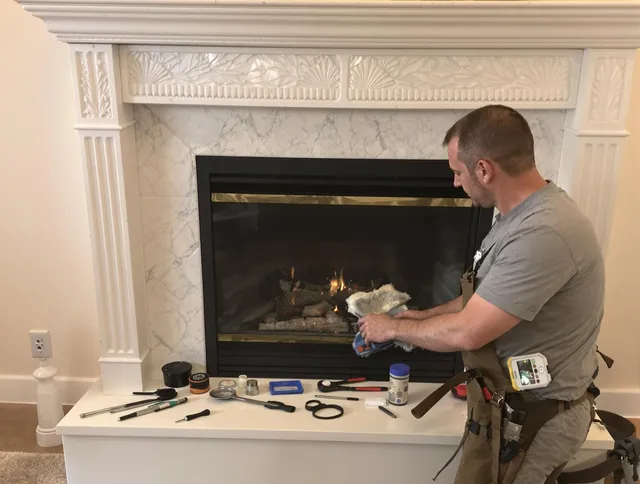 Wallingford Center Chimney Sweep performing fireplace maintenance in Wallingford Center, CT