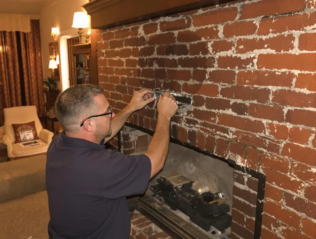 Wallingford Center Chimney Sweep expert fixing a fireplace in Wallingford Center, CT